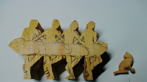 begin woodcarving of ballerinas and cat